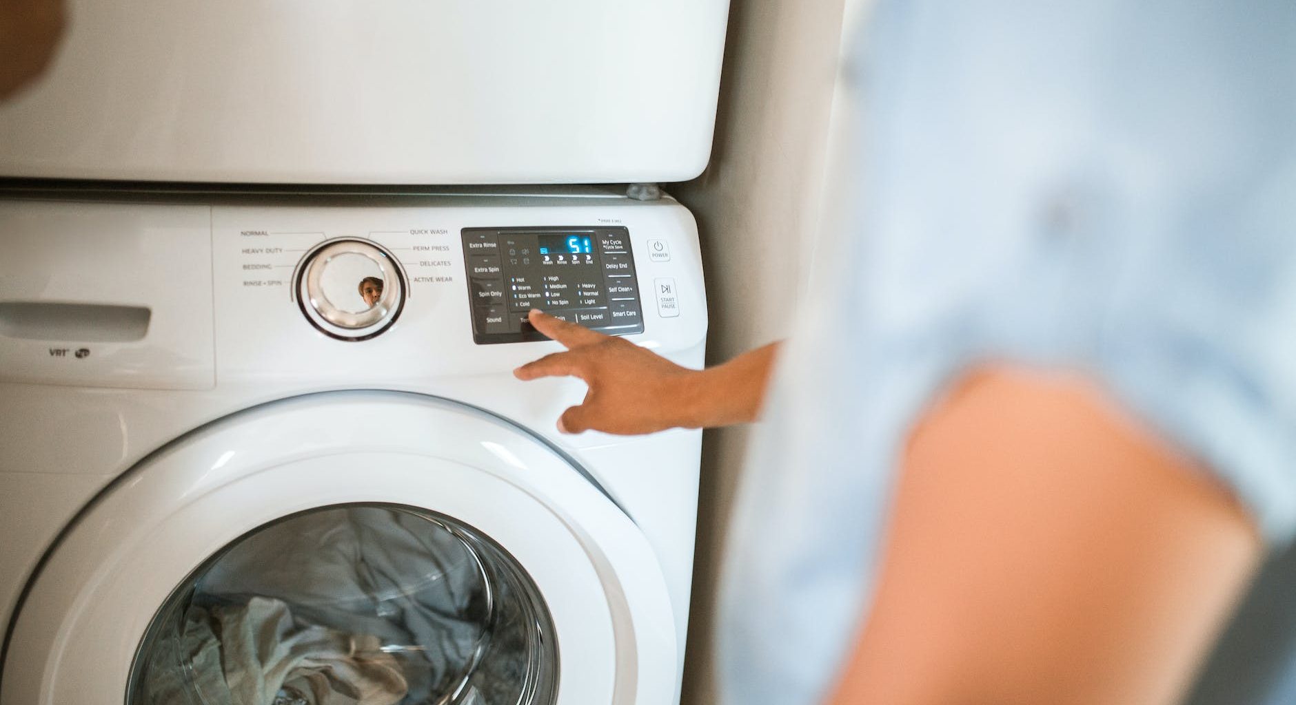 person using washing machine