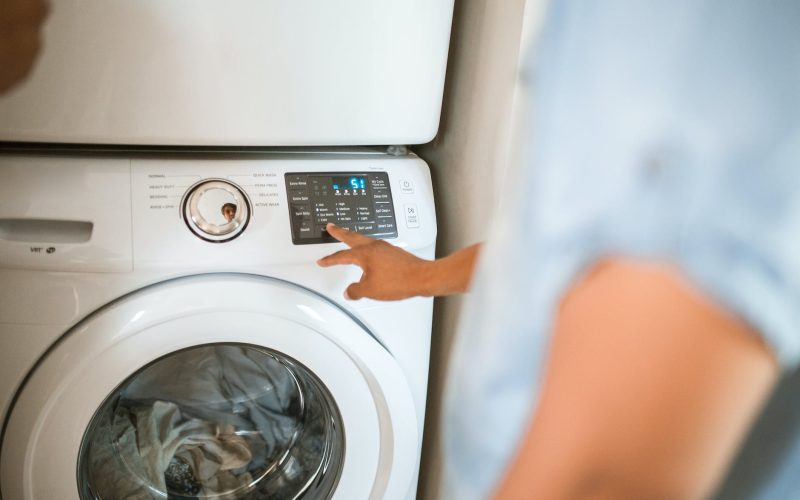 person using washing machine