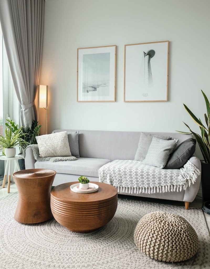 a living room filled with furniture and a large window