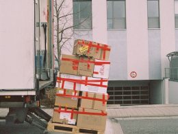 brown cardboard boxes on gray asphalt road