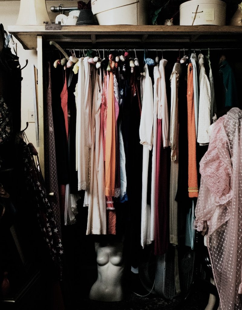 clothes hanged inside wardrobe