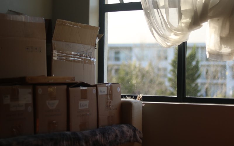 a room with boxes and a window