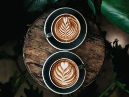 high angle photo of two green mugs filled with coffee