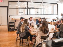 talking people sitting beside table