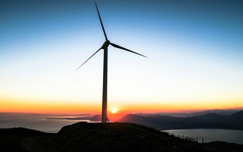 silhouette of wind mill during golden hour