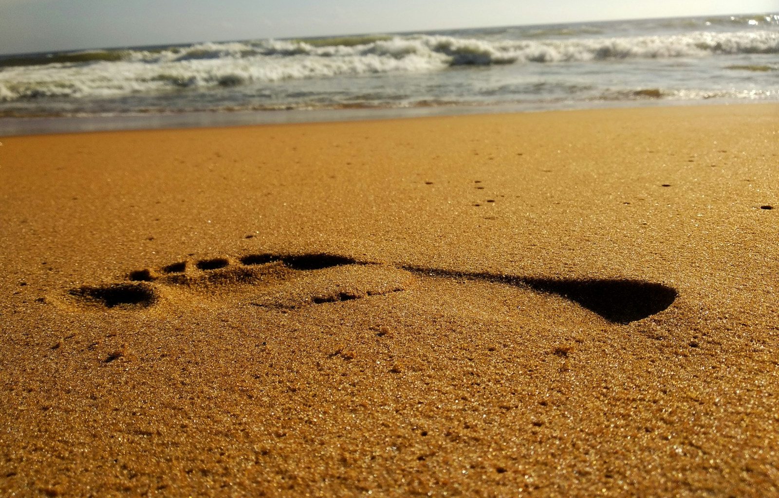 right foot print in the sand