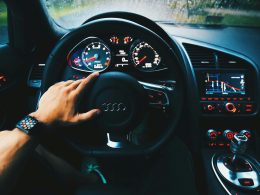 black Audi vehicle steering wheel