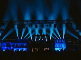 a stage lit up with blue lights at night