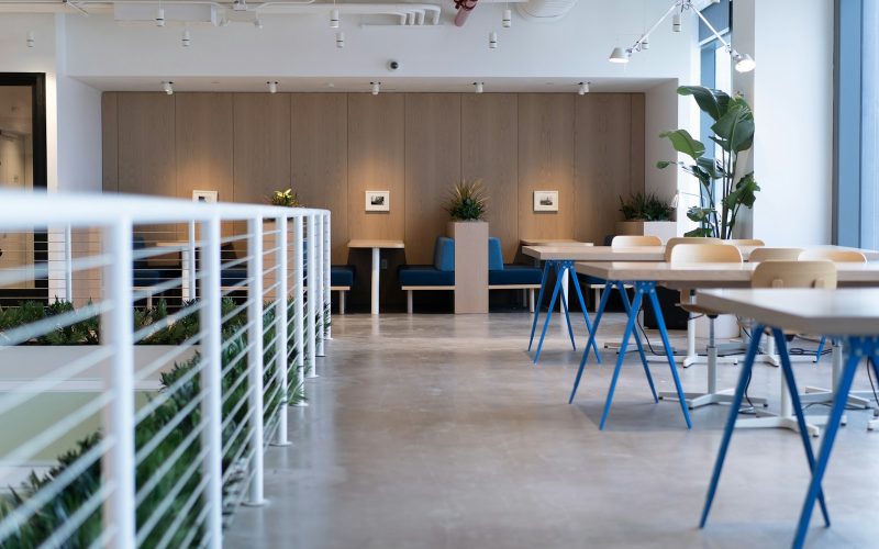 white-and-blue tables facing white balustrade