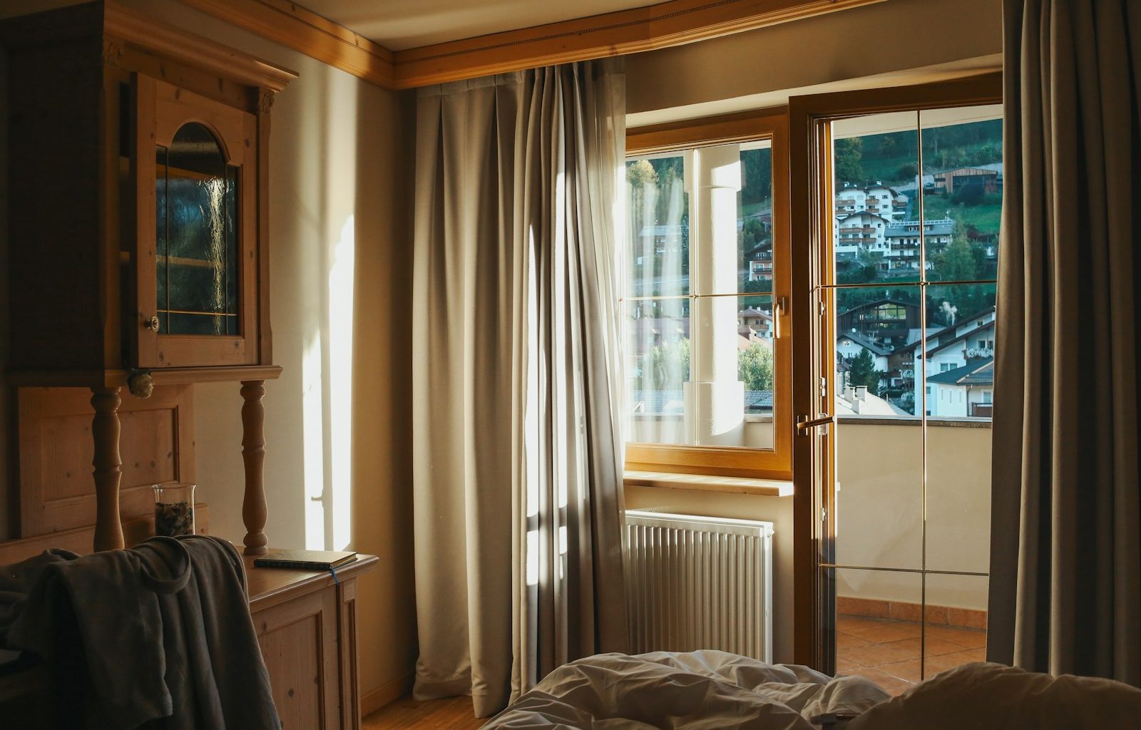 a bedroom with a bed and a window