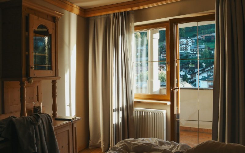 a bedroom with a bed and a window