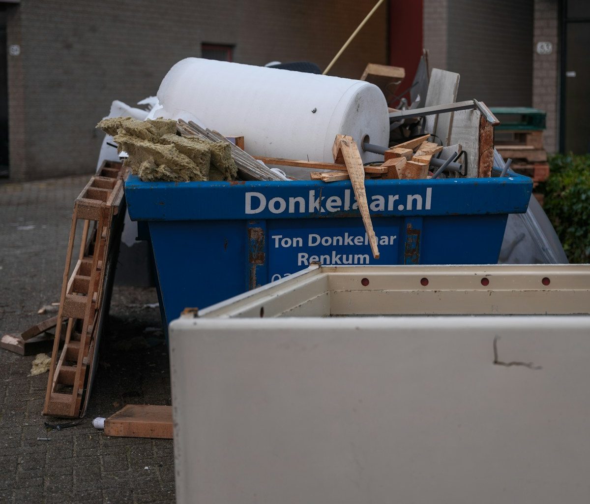 A pile of junk sitting outside of a building
