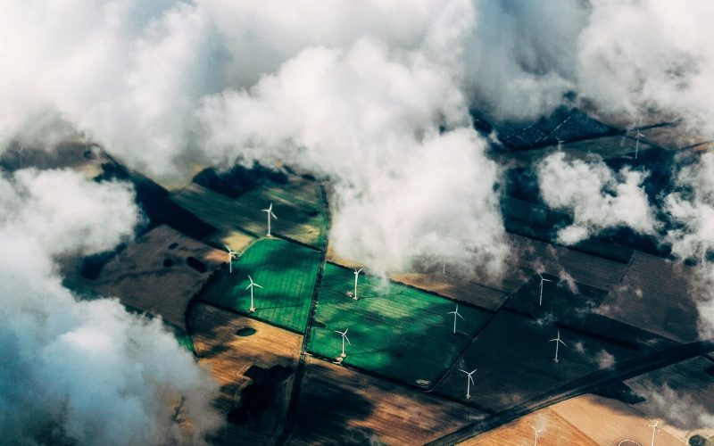 aerial photo of wind turbines near field