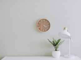 white desk lamp beside green plant