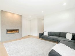black couch near black fireplace