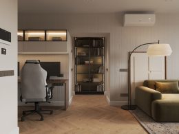 A living room with a couch a chair and a desk