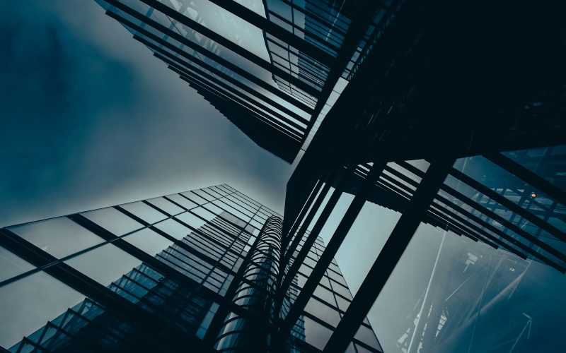 a group of tall buildings towering up into the sky