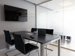 a table with chairs and a television