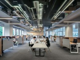 man and woman sitting on table