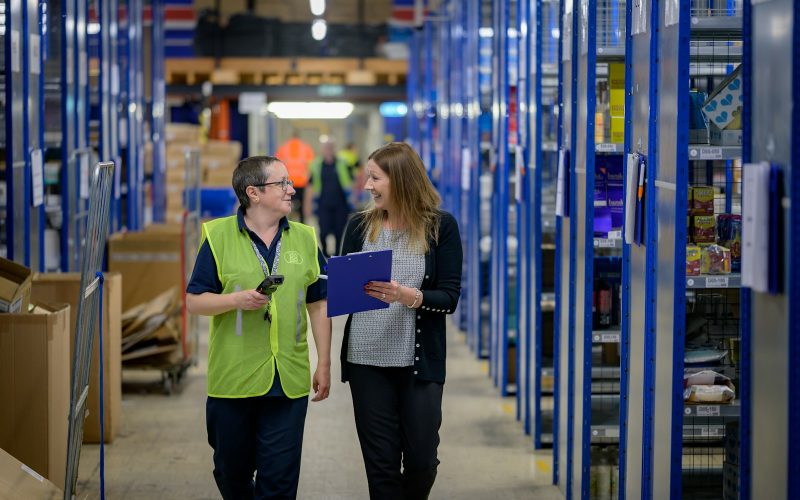 a man and a woman in a warehouse