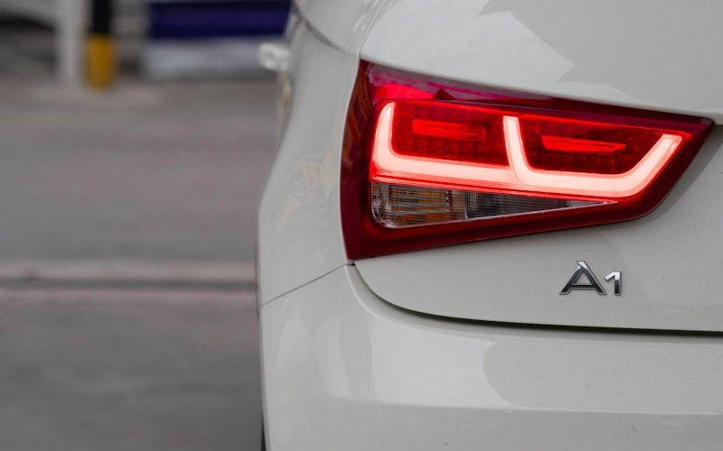 a close up of the tail light of a white car