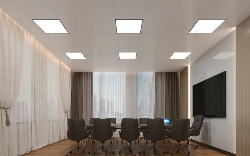 Modern conference room with large table and chairs.