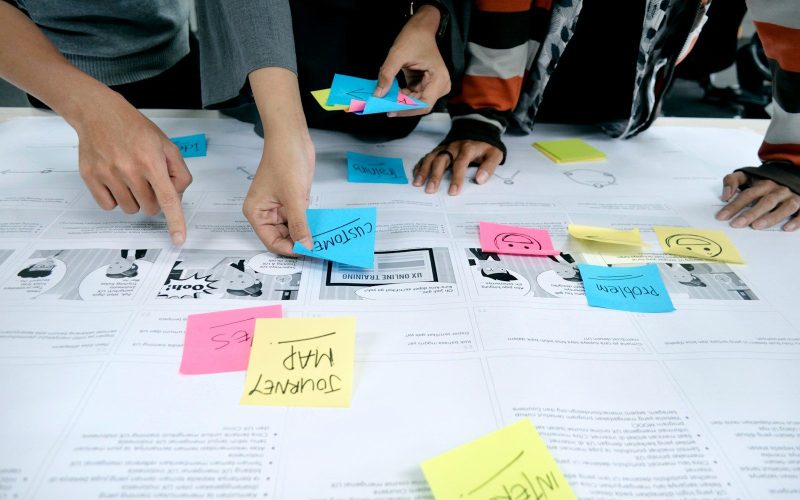 team collaborating with sticky notes